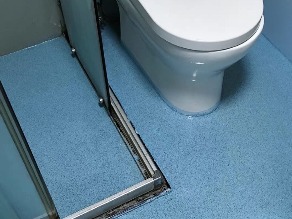 Seamless blue floor coating in a bathroom