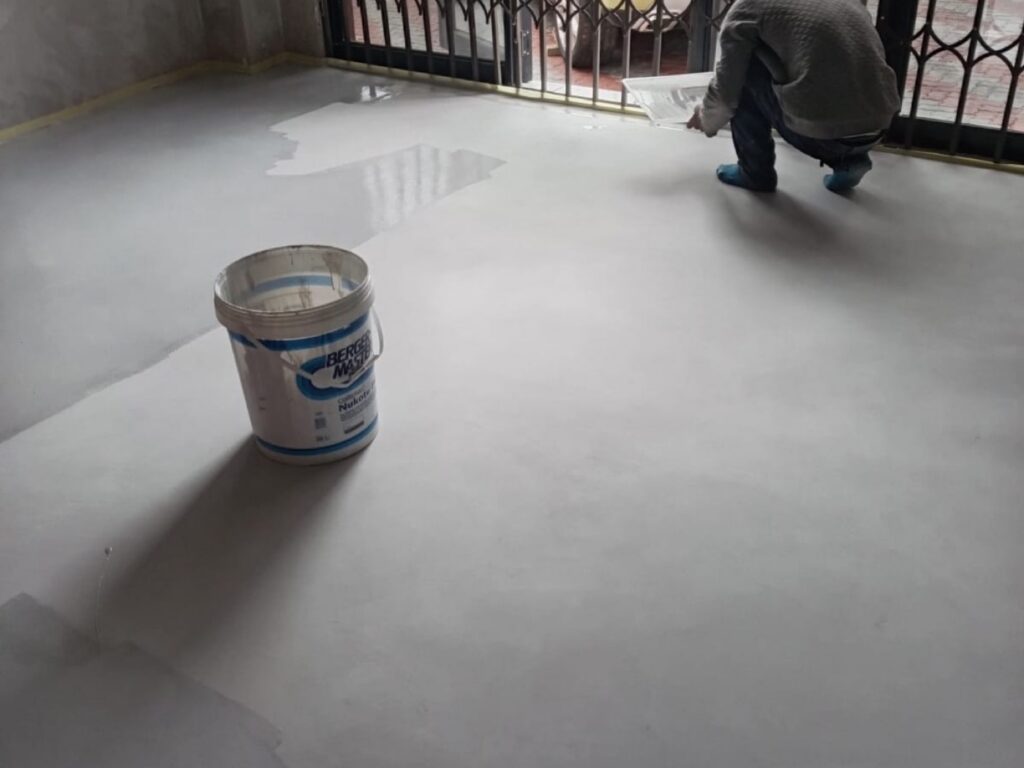 Epoxy floor being installed in a residential space