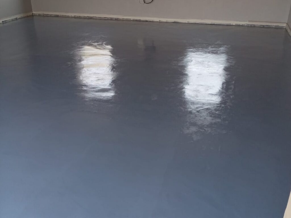 Grey blue epoxy floor in a residential room